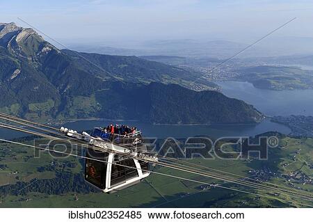 "CabriO Bahn, the world's first cable car with an open top deck, going up Stanserhorn Mountain, Stans, Switzerland, Europe" View Large Photo Image Stock Photography - "CabriO Bahn, the world's first cable car with an open top deck, going up Stanserhorn Mountain, Stans, Switzerland, Europe". Fotosearch