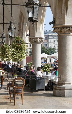 Stock Photography - "Cafe at Sukiennice, Renaissance Cloth Hall, on Rynek Glowny or Main Market Square, Krakow, Poland, Europe". Fotosearch