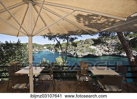 "Cafe overlooking the harbour entrance of Figuera, Cala Figuera, Mallorca, Majorca, Balearic Islands, Spain, Europe" View Large Photo Image Stock Image - "Cafe overlooking the harbour entrance of Figuera, Cala Figuera, Mallorca, Majorca, Balearic Islands, Spain, Europe". Fotosearch