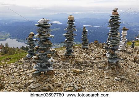 "Cairns, sculpture """"Regards to Tibet"""" by Johannes Matthiessen, 2009, at Mt Gerlitzen, Nock Mountains, Carinthia, Austria, Europe" View Large Photo Image Stock Image - "Cairns, sculpture """"Regards to Tibet"""" by Johannes Matthiessen, 2009, at Mt Gerlitzen, Nock Mountains, Carinthia, Austria, Europe". Fotosearch