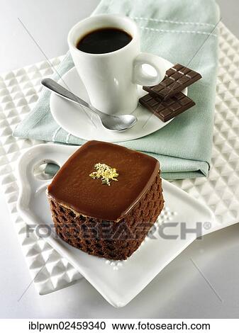 Cake with a sponge case and chocolate filling View Large Photo Image Stock Image - Cake with a sponge case and chocolate filling. Fotosearch