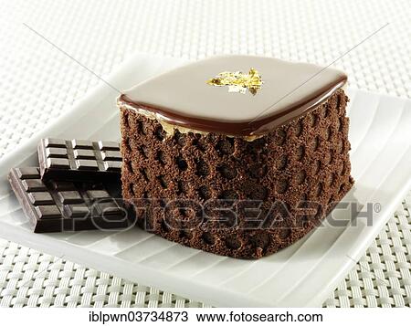Cake with a sponge case and chocolate filling View Large Photo Image Stock Image - Cake with a sponge case and chocolate filling. Fotosearch