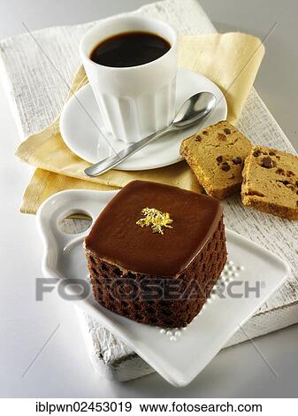 Cake with a sponge case and chocolate filling View Large Photo Image Stock Photo - Cake with a sponge case and chocolate filling. Fotosearch