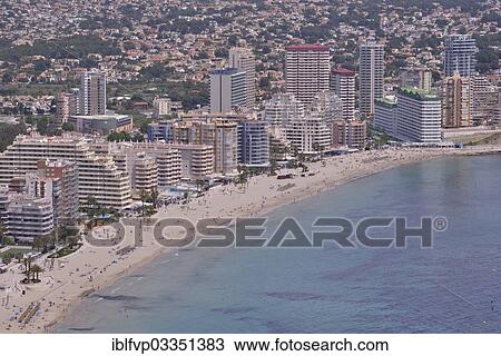 "Calp and the Playa Levante beach from the rock Penon de Ifach or Penyal d’Ifac, Costa Blanca, Calp, Costa Blanca, Alicante province, Spain, Europe" View Large Photo Image Stock Image - "Calp and the Playa Levante beach from the rock Penon de Ifach or Penyal d’Ifac, Costa Blanca, Calp, Costa Blanca, Alicante province, Spain, Europe". Fotosearch