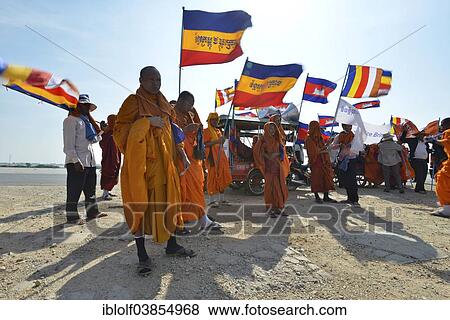 "Cambodian monks and novices at a protest with Buddhist flags and national flags of Cambodia, Kampong Cham Province, Cambodia, Asia" View Large Photo Image Stock Photo - "Cambodian monks and novices at a protest with Buddhist flags and national flags of Cambodia, Kampong Cham Province, Cambodia, Asia". Fotosearch