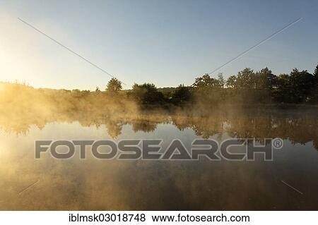 "Canal des Vosges, formerly the Canal de l'Est, at PK 88, summit level of the canal, morning mood with morning fog and morning sun, Les Forges, Epinal, Lorraine, Departement Vosges, France, Europe" View Large Photo Image Stock Photo - "Canal des Vosges, formerly the Canal de l'Est, at PK 88, summit level of the canal, morning mood with morning fog and morning sun, Les Forges, Epinal, Lorraine, Departement Vosges, France, Europe". Fotosearch