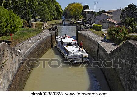 Stock Photo - "Canal du Midi with the """"Ecluses de Fresquel"""" lock, Pk 109, near Carcassonne, Languedoc-Roussillon, Aude, France, Europe". Fotosearch