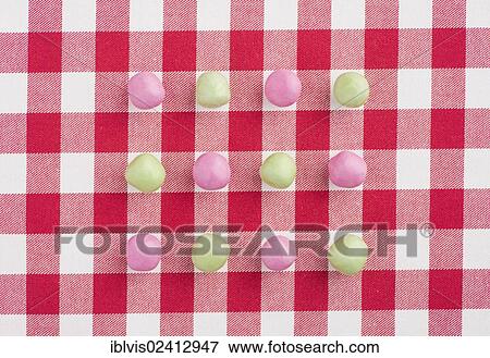 Candy on a red and white chequered tablecloth View Large Photo Image Stock Photo - Candy on a red and white chequered tablecloth. Fotosearch