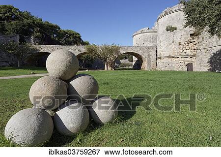 "Cannonballs made of stone in the moat, d'Amboise Gate at back, medieval fortress, City of Rhodes, Island of Rhodes, Dodecanese Islands, Greece, Europe" View Large Photo Image Stock Photo - "Cannonballs made of stone in the moat, d'Amboise Gate at back, medieval fortress, City of Rhodes, Island of Rhodes, Dodecanese Islands, Greece, Europe". Fotosearch