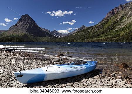 "Canoe at Two Medicine Lake, Sinopha Mountain at the back, Glacier National Park, Rocky Mountains, Montana, United States, North America" View Large Photo Image Stock Image - "Canoe at Two Medicine Lake, Sinopha Mountain at the back, Glacier National Park, Rocky Mountains, Montana, United States, North America". Fotosearch