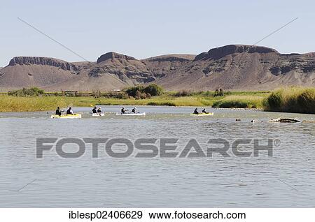 Stock Photo - "Canoe trip on the Oranje, Orange River, border river between Namibia and South Africa". Fotosearch