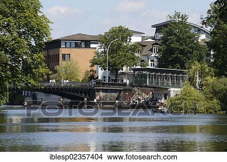 Picture - "Canoes on the Osterbekkanal canal, Muehlenkamp pier, Hamburg, Hamburg, Germany, Europe". Fotosearch