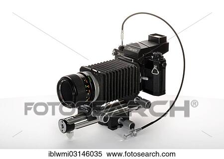 Stock Photography - "Canon F-1, model from 1976, with bellows FL with a 3. 5 - 50mm FD lens, SSC, sports finder, cable release, Germany, Europe". Fotosearch
