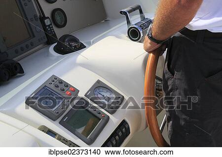 "Captain at the wheel on the flybridge, Leonardo II, a cruiser built by Azimut, type of boat: Leonardo 98, length: 30. 15 m, built in 2004, French Riviera, France, Mediterranean Sea, Europe" View Large Photo Image Stock Image - "Captain at the wheel on the flybridge, Leonardo II, a cruiser built by Azimut, type of boat: Leonardo 98, length: 30. 15 m, built in 2004, French Riviera, France, Mediterranean Sea, Europe". Fotosearch