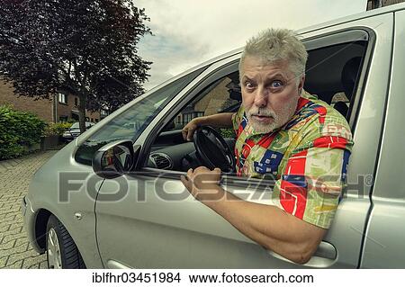 "Car driver looking out of the car window angrily, Grevenbroich, Rhineland, North Rhine-Westphalia, Germany, Europe" View Large Photo Image Picture - "Car driver looking out of the car window angrily, Grevenbroich, Rhineland, North Rhine-Westphalia, Germany, Europe". Fotosearch