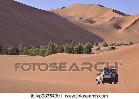 "Car driving in the dunes, Great Sand Sea, Sahara, Merzouga, Meknes-Tafilalet region, Morocco, Africa" View Large Photo Image Stock Image - "Car driving in the dunes, Great Sand Sea, Sahara, Merzouga, Meknes-Tafilalet region, Morocco, Africa". Fotosearch