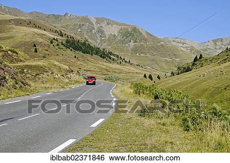 Stock Photograph - "Car driving on the Col du Tourmalet road, mountain pass road, mountains, Bareges, Midi-Pyrenees, Pyrenees, departement of Hautes-Pyrenees, France, Europe, PublicGround, Europe". Fotosearch
