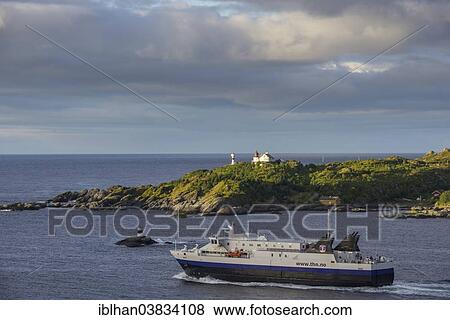 Stock Photo - "Car ferry and lighthouse, Moskenes, Lofoten, Nordland, Norway, Europe". Fotosearch