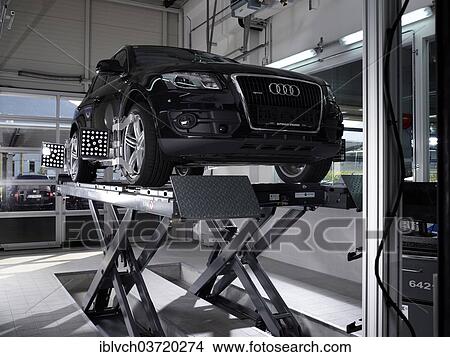 "Car on a hoist with fitted pressure test panels for the wheel alignment, car repair shop, St. Gertraudi, Reith im Alpbachtal, Kufstein District, North Tirol, Tirol, Austria, Europe" View Large Photo Image Picture - "Car on a hoist with fitted pressure test panels for the wheel alignment, car repair shop, St. Gertraudi, Reith im Alpbachtal, Kufstein District, North Tirol, Tirol, Austria, Europe". Fotosearch