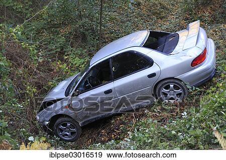 "Car which has driven off the road and down an embankment, traffic accident" View Large Photo Image Stock Photo - "Car which has driven off the road and down an embankment, traffic accident". Fotosearch