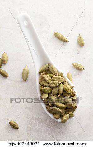 Cardamom pods on a spoon View Large Photo Image Stock Image - Cardamom pods on a spoon. Fotosearch