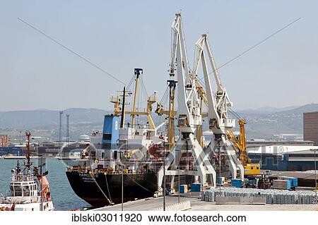 "Cargo ship being unloaded in the port of Koper, Slovenia, Europe, Koper, Slovenian Littoral, Slovenia, Europe" View Large Photo Image Stock Image - "Cargo ship being unloaded in the port of Koper, Slovenia, Europe, Koper, Slovenian Littoral, Slovenia, Europe". Fotosearch