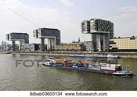 "Cargo ship, crane towers, office buildings, residential buildings, Rhine, Rheinauhafen, Cologne, Rhineland, North Rhine-Westphalia, Germany, Europe" View Large Photo Image Picture - "Cargo ship, crane towers, office buildings, residential buildings, Rhine, Rheinauhafen, Cologne, Rhineland, North Rhine-Westphalia, Germany, Europe". Fotosearch