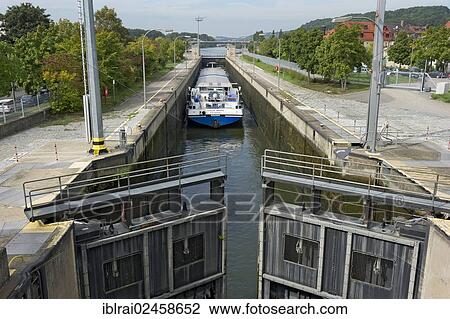 "Cargo ship in a lock, sluice gates being closed for flooding, Rhine? ÇôMain? ÇôDanube Canal, Regensburg, Upper Palatinate, Bavaria, Germany, Europe" View Large Photo Image Stock Image - "Cargo ship in a lock, sluice gates being closed for flooding, Rhine? ÇôMain? ÇôDanube Canal, Regensburg, Upper Palatinate, Bavaria, Germany, Europe". Fotosearch