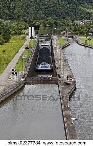 Picture - "Cargo ship on the Saar river near Konz, Konzem lock near Hamm, Konz, Rhineland-Palatinate, Germany, Europe". Fotosearch