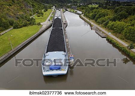 Stock Photograph - "Cargo ship on the Saar river near Konz, Konzem lock near Hamm, Konz, Rhineland-Palatinate, Germany, Europe". Fotosearch