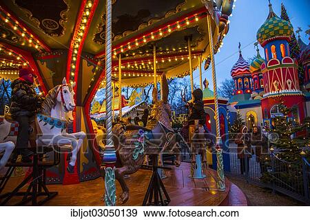 "Carousel, Christmas market in the Tivoli Gardens amusement park, city centre, Kopenhagenop, Denmark, Europe" View Large Photo Image Stock Photo - "Carousel, Christmas market in the Tivoli Gardens amusement park, city centre, Kopenhagenop, Denmark, Europe". Fotosearch