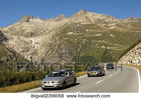 "Cars driving on the Furka Pass, the almost ice-free bed of the Rhone Glacier on the left, Belvedere Hotel in the centre, Gletsch, canton of Valais, Switzerland, Europe" View Large Photo Image Stock Photo - "Cars driving on the Furka Pass, the almost ice-free bed of the Rhone Glacier on the left, Belvedere Hotel in the centre, Gletsch, canton of Valais, Switzerland, Europe". Fotosearch