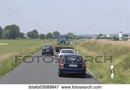 "Cars overtaking a tractor on a country road, Hallstadt, Bamberg, Upper Franconia, Bavaria, Germany, Europe" View Large Photo Image Stock Photo - "Cars overtaking a tractor on a country road, Hallstadt, Bamberg, Upper Franconia, Bavaria, Germany, Europe". Fotosearch