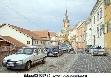 Stock Photography - "Cars parked in the historic city centre, Sibiu, Transylvania, Romania, Europe". Fotosearch