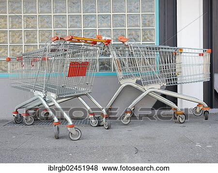 "Cart, parked messy on a wall" View Large Photo Image Stock Photo - "Cart, parked messy on a wall". Fotosearch