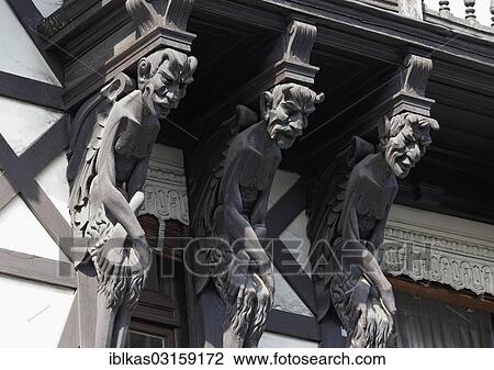 Stock Image - "Carved devil figures, """"Twaalf Duivels"""" or """"Twelve Devils"""" building, Zurenborg, Antwerpen, Flemish Region, Belgium, Europe". Fotosearch