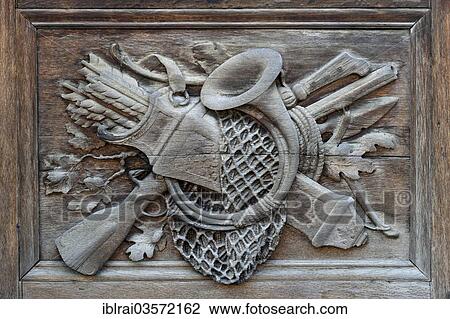 "Carved relief image with hunting motifs on the wooden portal, Schleissheim New Palace, east side, Oberschleissheim, Upper Bavaria, Bavaria, Germany, Europe" View Large Photo Image Stock Image - "Carved relief image with hunting motifs on the wooden portal, Schleissheim New Palace, east side, Oberschleissheim, Upper Bavaria, Bavaria, Germany, Europe". Fotosearch