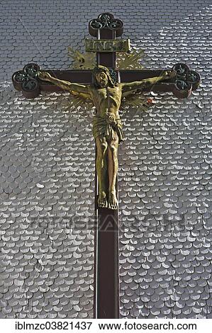 "Carved wooden crucifix on the shingle facade of the parish church of St. Margaret, from 1791, Kleinweiler, Upper Allgaeu, Bavaria, Germany, Europe" View Large Photo Image Stock Photo - "Carved wooden crucifix on the shingle facade of the parish church of St. Margaret, from 1791, Kleinweiler, Upper Allgaeu, Bavaria, Germany, Europe". Fotosearch