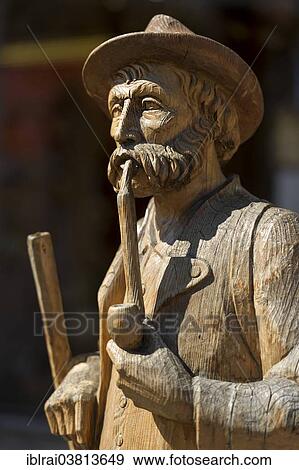 "Carved wooden figure, man with pipe, Mittenwald, Werdenfelser Land, Upper Bavaria, Bavaria, Germany, Europe" View Large Photo Image Stock Photo - "Carved wooden figure, man with pipe, Mittenwald, Werdenfelser Land, Upper Bavaria, Bavaria, Germany, Europe". Fotosearch