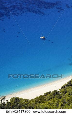Catamaran is a bay with shimmering blue water, Lefkas or Lefkada, Greece, Europe View Large Photo Image Stock Image - Catamaran is a bay with shimmering blue water, Lefkas or Lefkada, Greece, Europe. Fotosearch