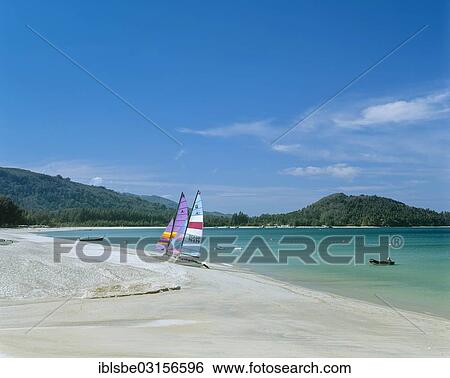 Stock Photograph - "Catamaran on a white sandy beach, Bang Tao Beach, Phuket, Phuket Province, Thailand, Asia". Fotosearch