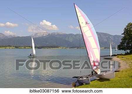 Stock Photograph - "Catamaran on Lake Forggen, Fussen, Allgau, Upper Bavaria, Bavaria, Germany, Europe". Fotosearch