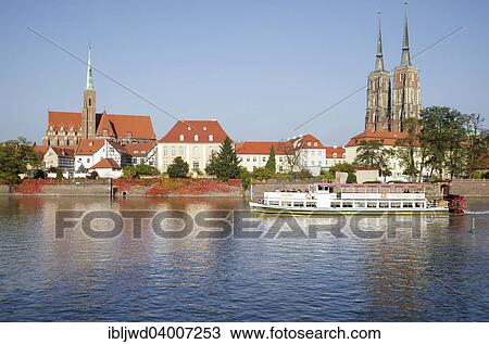 Stock Image - "Cathedral Island Ostrow Tumski with tourist boat on the River Oder, Wroclaw, Poland, Europe". Fotosearch