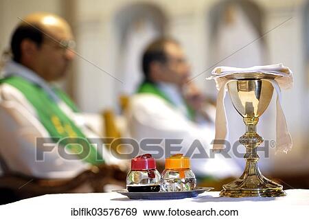 "Catholic mass, chalice and containers with wine and water for the preparation of the celebration of the Eucharist, San Joaquin, Caaguazu Department, Paraguay, South America" View Large Photo Image Stock Photo - "Catholic mass, chalice and containers with wine and water for the preparation of the celebration of the Eucharist, San Joaquin, Caaguazu Department, Paraguay, South America". Fotosearch