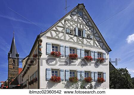"Catholic parish office of St. Kunigund, an old half-timbered house built in 1752, Parish Church of St. Kunigund at the back, Marktplatz square 27, Schnaittach, Middle Franconia, Bavaria, Germany, Europe" View Large Photo Image Stock Image - "Catholic parish office of St. Kunigund, an old half-timbered house built in 1752, Parish Church of St. Kunigund at the back, Marktplatz square 27, Schnaittach, Middle Franconia, Bavaria, Germany, Europe". Fotosearch