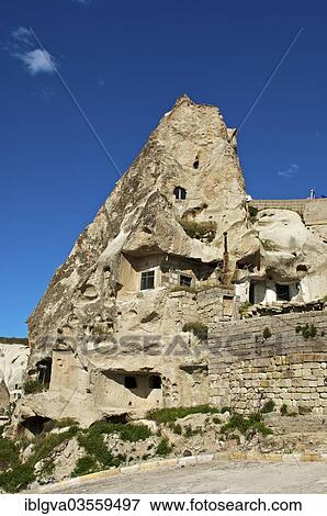 "Cave dwellings in hollowed tuff rock, Goreme, Cappadocia, Nevsehir Province, Central Anatolia Region, Turkey, Asia" View Large Photo Image Stock Photo - "Cave dwellings in hollowed tuff rock, Goreme, Cappadocia, Nevsehir Province, Central Anatolia Region, Turkey, Asia". Fotosearch