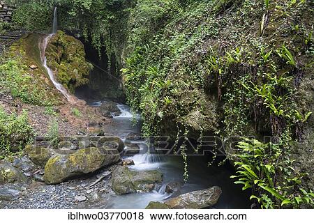 Stock Photo - "Cave in the ravine of the Salentze River, with a spring above, Saillon, Martigny, Canton of Valais, Switzerland, Europe". Fotosearch