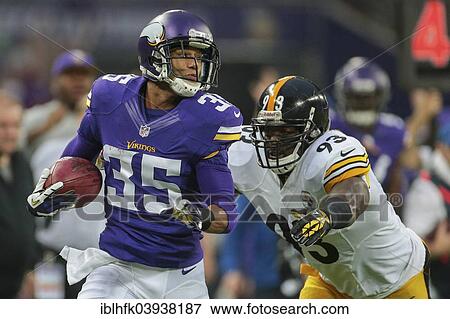 Stock Photo - "CB Marcus Sherels, No. 35 Vikings, running with the ball at a NFL International game between the Minnessota Vikings and the Pittsburgh Steelers, Wembley Stadium, London, England, United Kingdom, Europe". Fotosearch