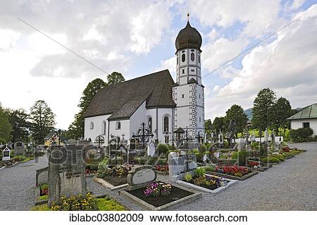 Stock Photo - "Cemetery Church of Virgin Mary the Protector within a cemetery, Fischbachau, Bavaria, Germany, Europe". Fotosearch