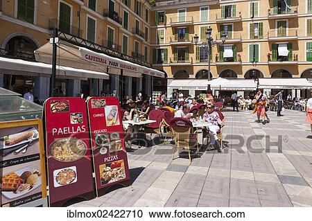 Central street cafes offering paella on Placa de Major square, historic town centre, Palma de Majorca, Majorca, Balearic Islands, Spain, Europe View Large Photo Image Stock Image - Central street cafes offering paella on Placa de Major square, historic town centre, Palma de Majorca, Majorca, Balearic Islands, Spain, Europe. Fotosearch